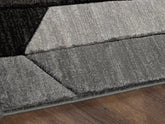 Bay Furniture Gallery - Ashley Furniture - Chayse Rug - 6'6" x 9'6" Rug / Black/Gray - R403461